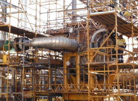 Insulated piping and scaffolding at an oil-and-gas facility