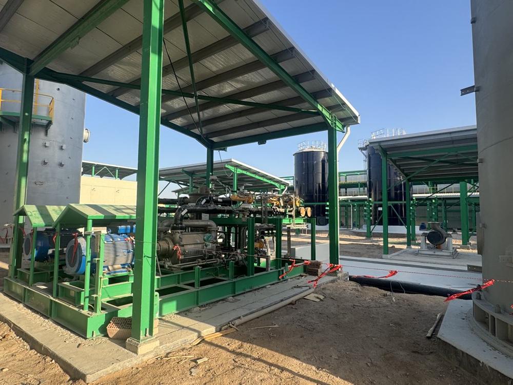 Pump skid installed under a steel canopy at the water treatment plant