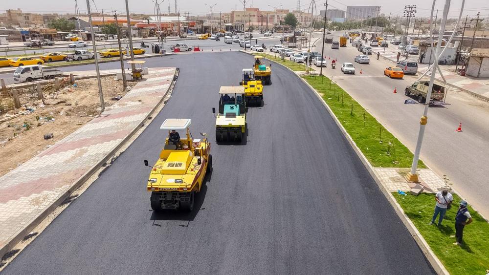 Aerial view of AAE road paving and compaction works with landscaped median